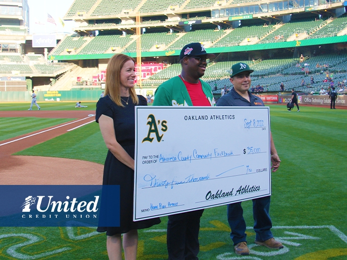 Representatives from the Oakland A's Community Fund and 1st United Credit Union present a check for $35,000 to Alameda County Community Food Bank during the September 24, 2022 Oakland A's game.