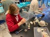 King School student Maddy Beck at work in the art studio. Beck is an avid advocate for women’s rights and explores that theme in her artwork.