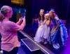 King Upper School Performing Arts students Luisa Simon and Isabella Kolenberg pose with a fan after a performance of "Cinderella" at the Fringe Festival in Edinburgh, Scotland.