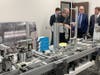 Joey Watkins explains the importance of advanced PLC manufacturing line training to Commissoner Dozier as TCSG Asst. Commissioner, Neil Bitting, and Dr. Perren look on.