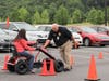 Lanier Tech Chief of Police, Jeff Strickland, assists an “impaired” student driver.