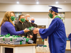 Pictured: Student Council President Nathaniel Kerr receives gift from Principal Cheryl Panzo, and is greeted by ESCA's three pastors to receive his diploma from Fr. Stephen Sledesky,  Fr. Philip Schulze, and Fr. Daniel Keefe