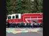 Captain Randy Chittenden and Firefighter Gionteris pose with PreK3 and PreK4 students with Branford Fire Truck 1