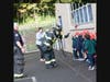 Firefighter and Paramedic Gionteris shows students what a firefighter looks like when they respond to a home fire emergency.