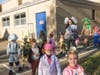 PreK4 students make their way to join the parade outside.