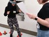 Fatin Abdelrahim (Stagg) and Bridget Lynch (Sandburg) navigating a trust walk in French