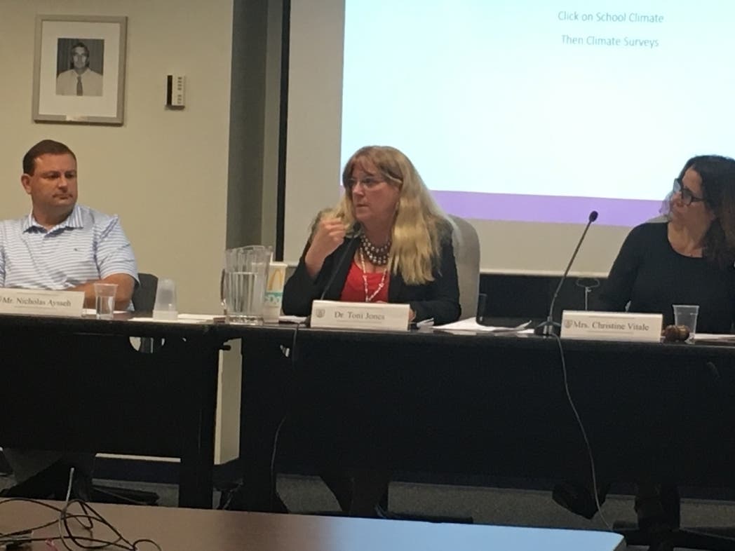 Fairfield school officials Nick Aysseh (from left), Toni Jones and Christine Vitale attend Tuesday's board meeting.