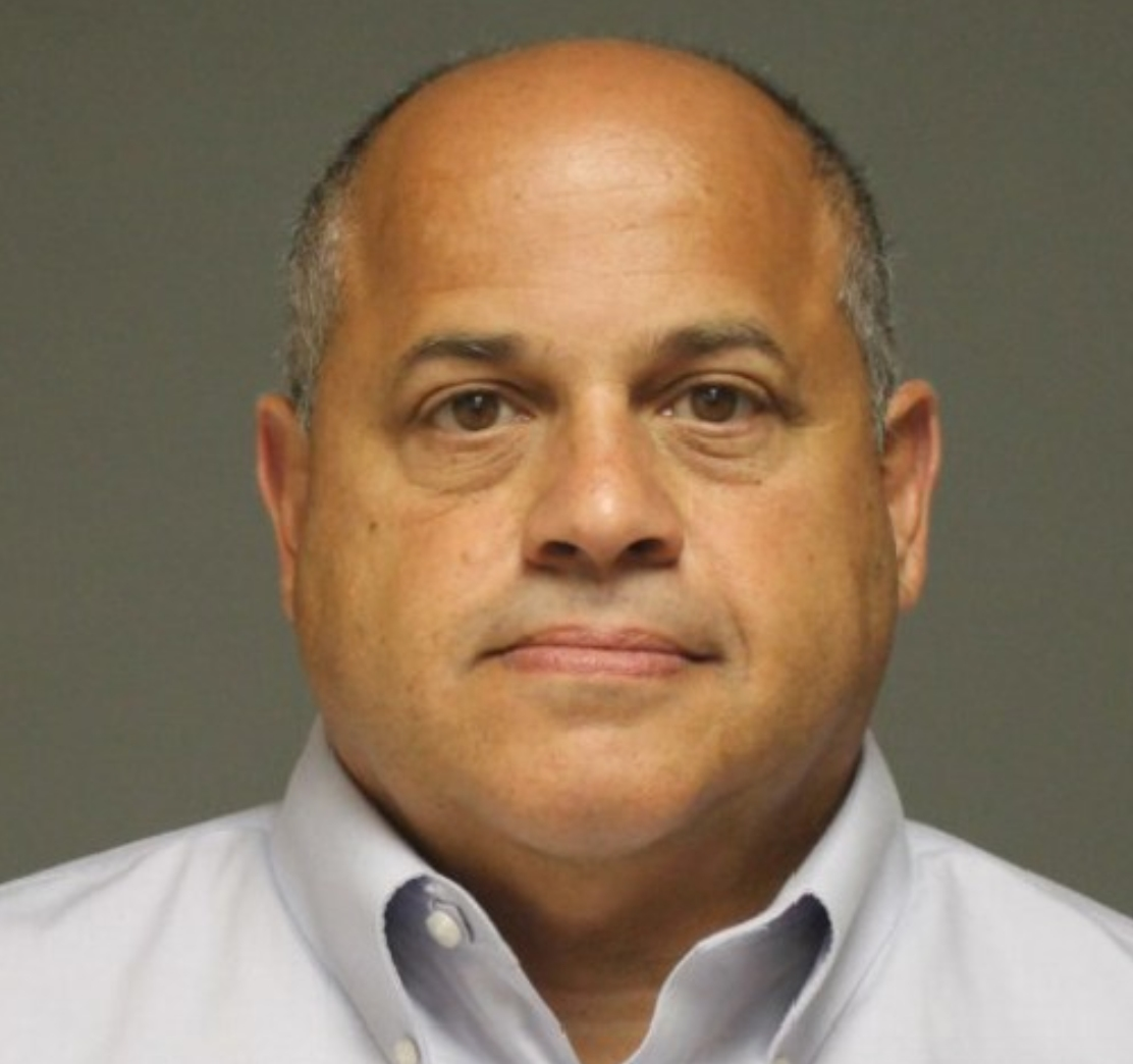 Director of Public Works Joe Michelangelo is charged with forgery, illegal dumping, illegal discharge and handling waste without a permit.