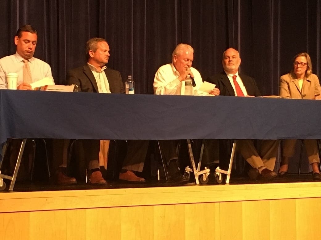 First Selectman Mike Tetreau (center) addresses the crowd Wednesday at a public meeting about contamination testing.