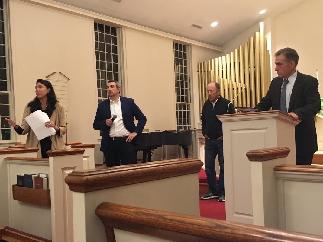 Community members involved in the neighbor opposition to Newport Academy speak at a meeting Thursday.