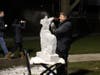 Ice carver Bill Covitz demonstrates his craft on Sherman Green.