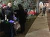 The Judy Mitchell Group of William Pitt Sotheby's Realty gives out hot cocoa to passersby.