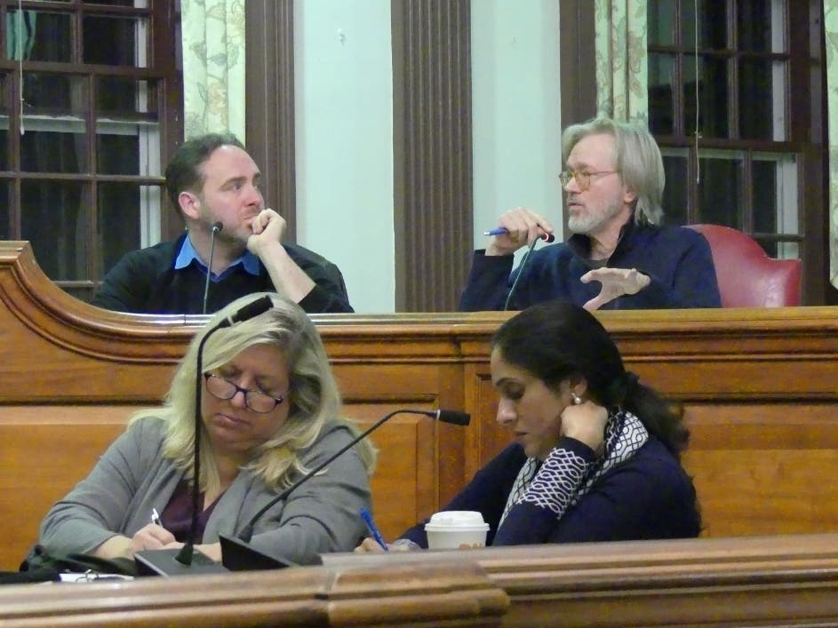 Shakespeare Property Subcommittee member Peter Wood speaks to Tom Evans at a meeting Thursday.