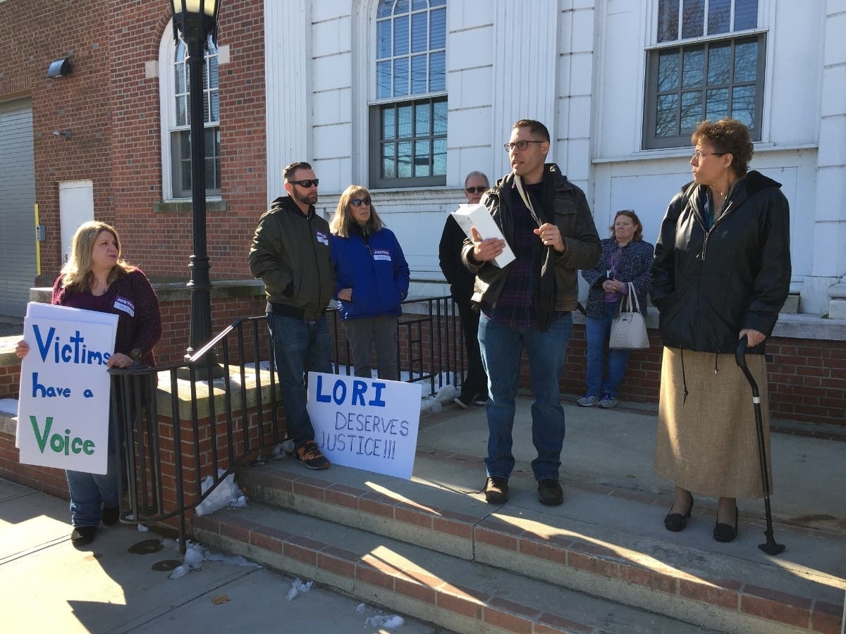 Tim McLaughlin speaks on the steps of the Milford courthouse after a plea deal for his sister's accused attacker was dropped.