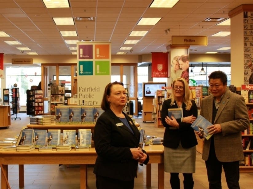 Fairfield Public Library's Deputy Town Librarian Jan Fisher introduces the 2020 One Book One Town selection, "Running with Sherman," on Jan. 7 at the Fairfield University Bookstore.