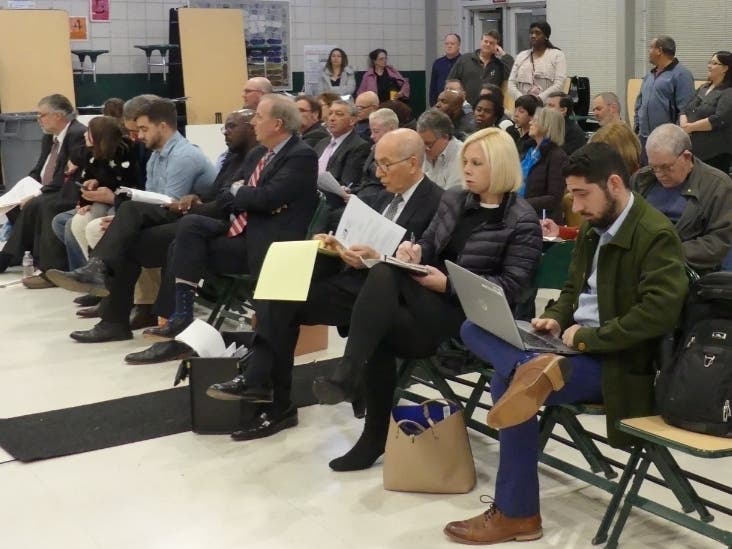 A crowd looks on Tuesday at a zoning commission meeting where two affordable housing projects — including one at 980 High St. — were discussed.