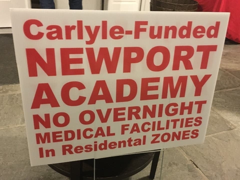 A sign is seen outside an October meeting of the neighborhood group opposing Newport Academy's Fairfield facility.