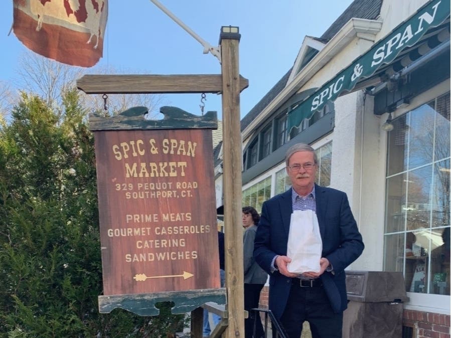 Fairfield Police Chief Christopher Lyddy grabs lunch from Spic & Span Market on March 18 as part of the department's new "Law and Order ... To Go" campaign to encourage officers and residents to order food from local restaurants.