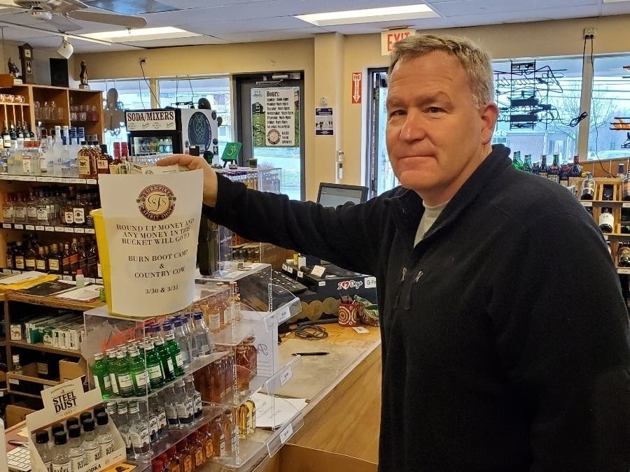Selectman Tom Flynn is seen at Turnpike Spirit Shop, which is raising money to assist businesses that are closed due to the new coronavirus.