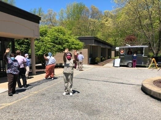 RegalCare ​hired T.H.E. Snickering Coyote to come park outside RegalCare at Southport.