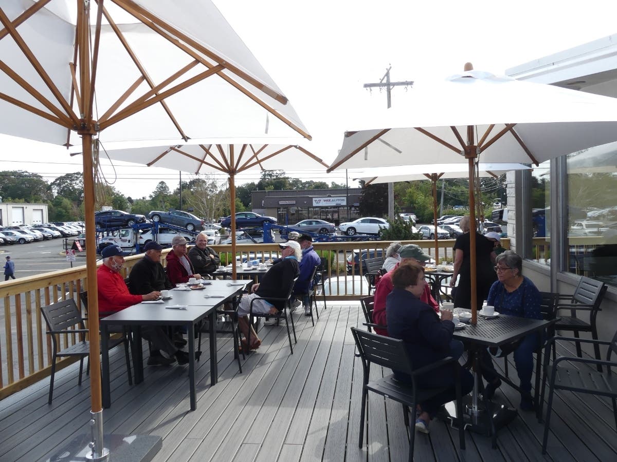 Customers eat Sept. 18 on the deck at Blue Sky Diner.