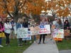 Fairfield parents hold signs during a rally Monday.