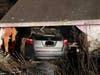 Stratford firefighters responded Thursday after a car hit a garage.