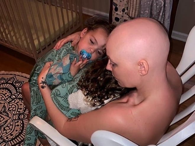 Sarah McWilliams rocks her twins, Archie and Lana Rose.