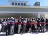 First Selectwoman Brenda Kupchick prepares to cut the ribbon at the grand opening of the town's new golf clubhouse.