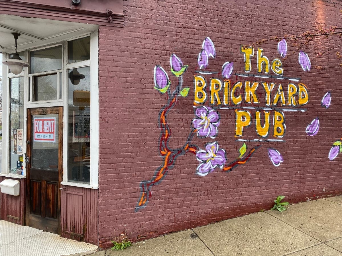 A "for rent" sign is seen on the door of the former Brickyard Pub location.