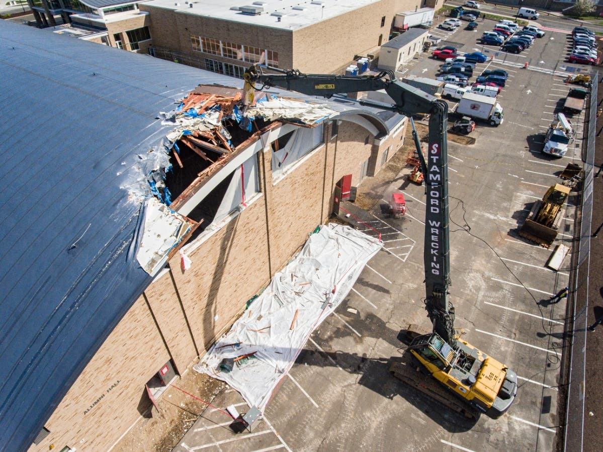 Alumni Hall is demolished Monday on the Fairfield University campus.