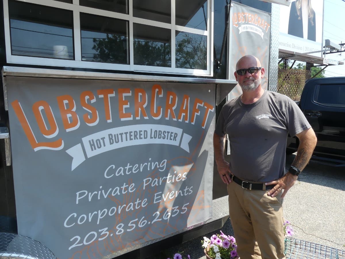 Capt. Mike Harden is seen at the trailer outside LobsterCraft's new Fairfield location, which is expected to open in the fall at 1814 Post Road.