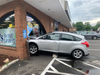 A car struck a front window Friday at Mo's Wine & Spirits.