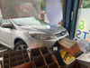 A car struck a front window Friday at Mo's Wine & Spirits.