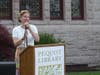 Executive Director Stephanie Coakley speaks Thursday outside Pequot Library.