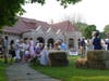 A crowd gathers Thursday to celebrate the roof replacement at Pequot Library.