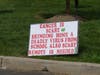 A sign is seen during a protest Monday outside Sullivan Independence Hall.
