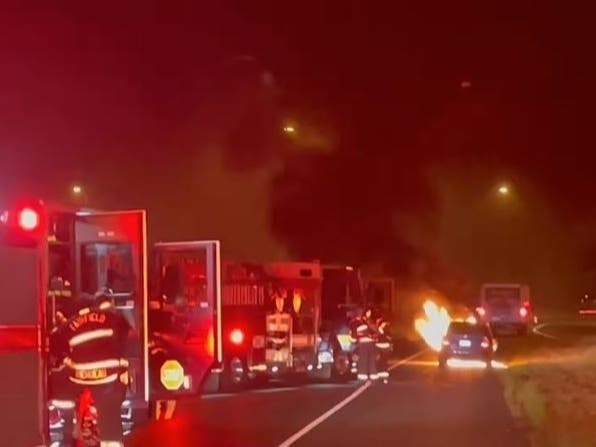 Firefighters respond to a car fire Tuesday.
