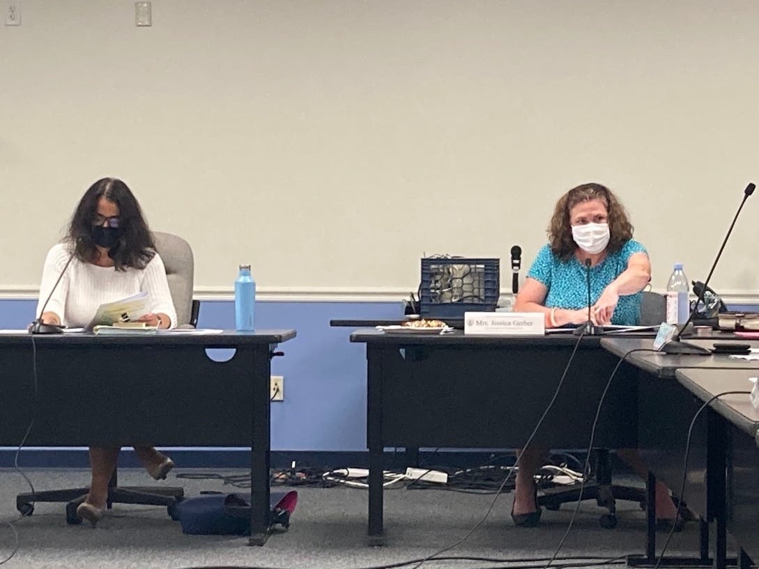 School board Chair Christine Vitale and Secretary Jessica Gerber attend Tuesday's meeting.