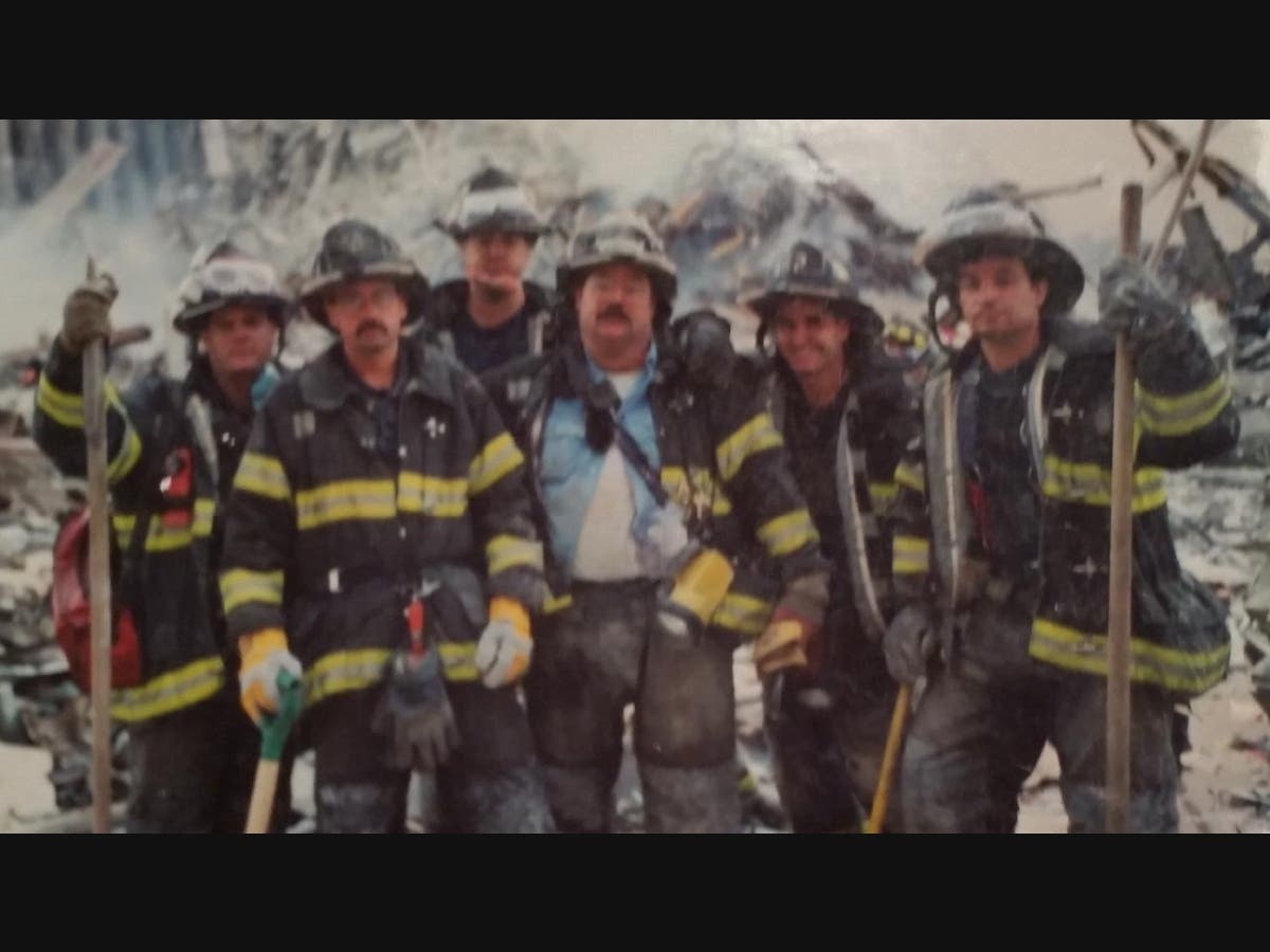 David Russell (third from right) is seen Sept. 13, 2001, at Ground Zero.