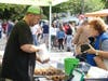 Jim Files, operator of Dude's Donuts, serves up seasonal snacks Saturday.