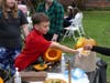 Michael Abdenour helps out at the pumpkin gut removal table for St. Paul's Episcopal Church.