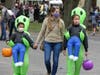 Oliver Perez (from left), Judy Castillo and Sofia Perez attend Halloween on the Green.