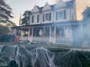 Ghosts and pumpkins line the porch to the Finlay home.