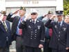 Veterans salute as "Taps" is played to conclude Thursday's ceremony.