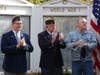 Veterans applaud during Thursday's ceremony.