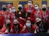 The Cardinals show off their state title plaque Saturday.
