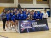 The Falcons show off their state runner-up plaque Saturday.