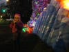 Remy Roffe, 2, enjoys a treat after Sunday's menorah lighting.