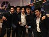 Yeshiva students Samuel Ichilevichi (from left), Yechi Hamellech, Menny Cohen, Moishe Bacher, and Moishe Feigestock attend Sunday's menorah-lighting event.